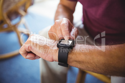 Senior man using a smart watch