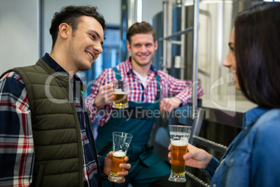 Brewers testing beer at brewery factory