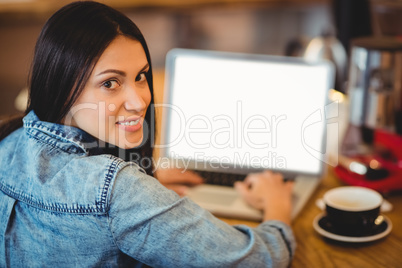 Woman using laptop at office