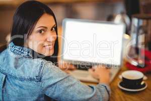 Woman using laptop at office