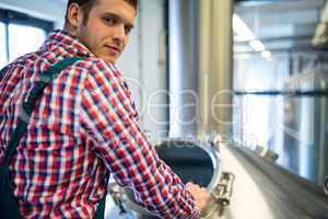 Maintenance worker working at brewery