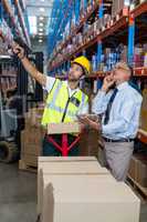 Businessman and warehouse worker
