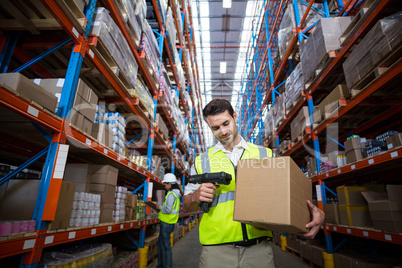 Worker scanning a box