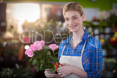 Female florist preparing flower bouquet