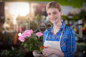 Female florist preparing flower bouquet