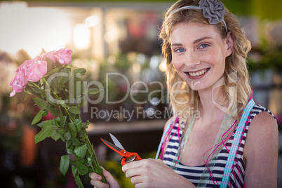 Female florist preparing flower bouquet