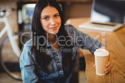 Portrait of woman having coffee