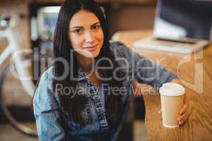 Portrait of woman having coffee