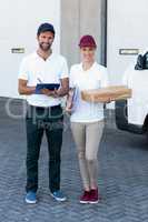 Delivery people are posing and holding goods