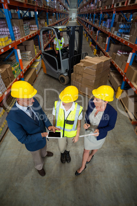 High angle view of managers talking with a worker