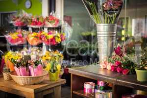 Plant pots and bouquet on table
