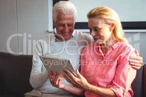 Senior couple using a digital tablet