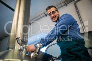 Maintenance worker working at brewery