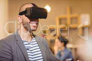 Male graphic designer wearing virtual glasses