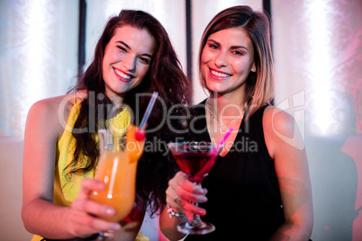 Portrait of beautiful women having cocktail