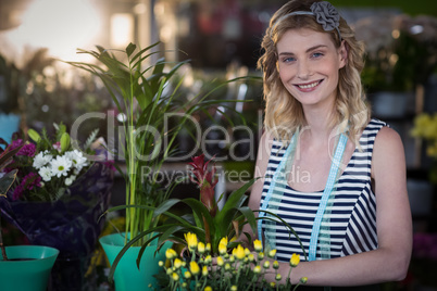 Female florist preparing flower bouquet