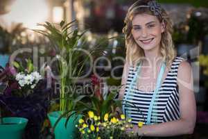 Female florist preparing flower bouquet