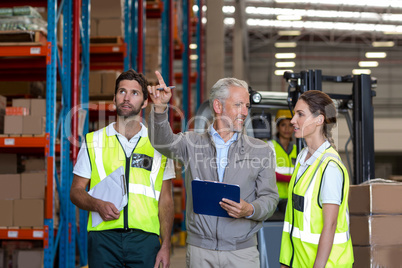 Manager is showing shelves to the workers