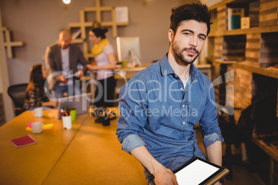 Graphic designer holding digital tablet