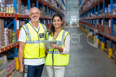 Happy workers are posing and smiling to the camera