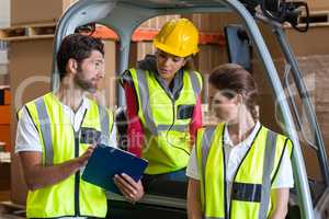 Portrait of workers are looking a clipboard