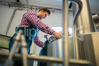 Maintenance worker working at brewery