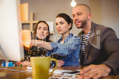 Team of graphic designer working on computer