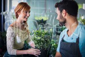 Couple arranging flower bouquet