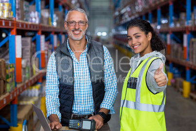 Worker is posing with thumbs up close up to her manager