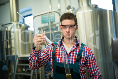 Brewer testing beer