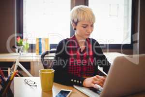 Young woman using laptop