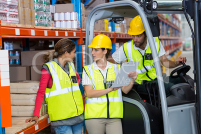 Workers are looking a clipboard