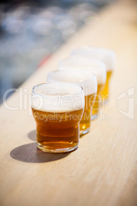 Close-up of beer glasses on the counter