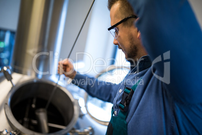 Brewer working at brewery