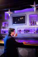 Man having beer at bar counter