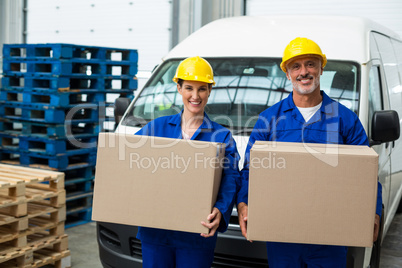 Smiling workers looking at camera