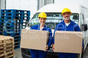 Smiling workers looking at camera