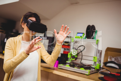 Female graphic designer using the virtual reality headset