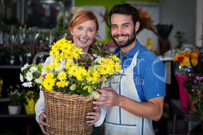 Couple standing with flower basket