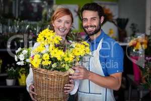 Couple standing with flower basket