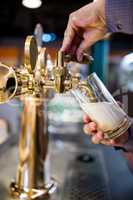 Bar tender pouring beer