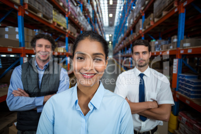 Focus of happy businesswoman posing face to the camera with her