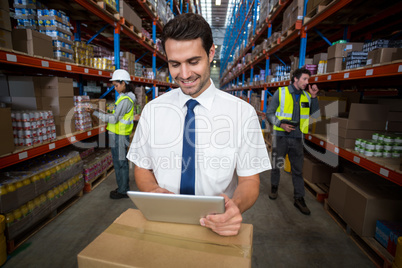 Business worker looking at digital tablet