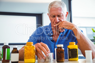 Senior man holding medicine