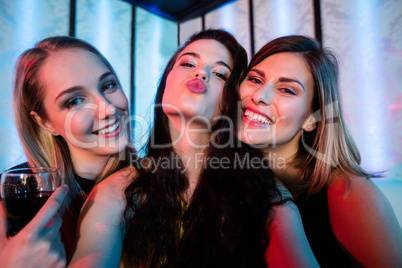 Portrait of friends posing while having wine Portrait of friends posing while having wine