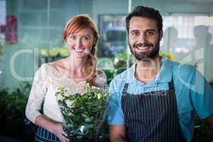 Happy couple holding flower bouquet