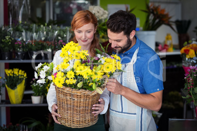 Couple standing with flower basket