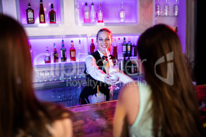 Waitress serving cocktail