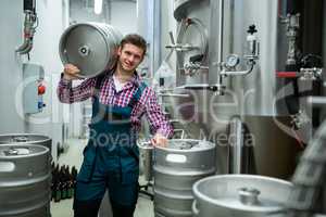 Brewer carrying keg on shoulder