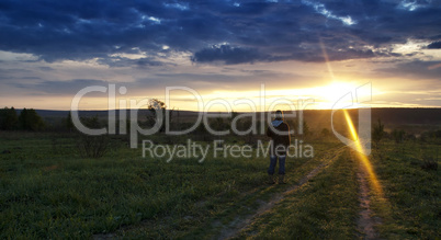 Horizontal girl meeting sunrise landscape backdrop